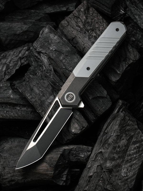 We Knife - 20073-4 Arsenal Frame Lock Black Stonewash Blade with Black Ti Handle/ Gray G10 Spacer