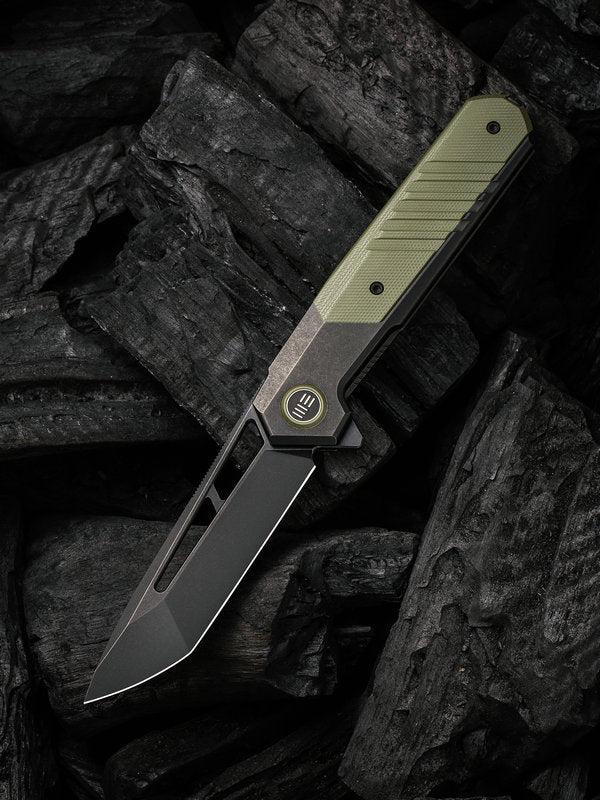 We Knife - 20073-2 Arsenal Frame Lock Black Stonewash Blade with Black Ti Handle/ OD Green G10 Spacer