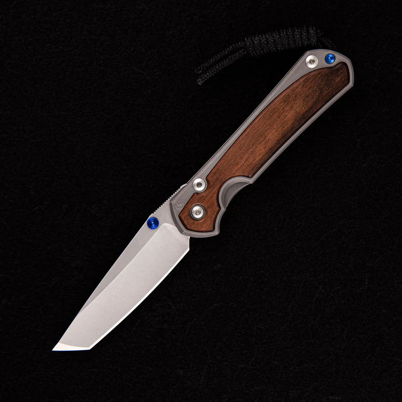 SMALL SEBENZA 31 MACASSAR INLAY – TANTO CPM MAGNACUT BLADE – BLUE DOUBLE THUMB LUGS