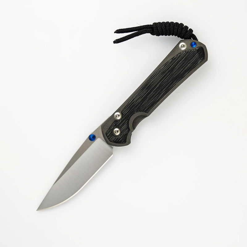 SMALL SEBENZA 31 BLACK CANVAS MICARTA INLAY – POLISHED CPM MAGNACUT BLADE – BLUE DOUBLE THUMB LUGS