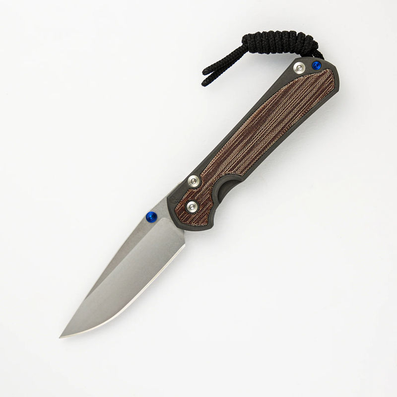 SMALL SEBENZA 31 NATURAL CANVAS MICARTA INLAY – CPM MAGNACUT BLADE – BLUE DOUBLE THUMB LUGS