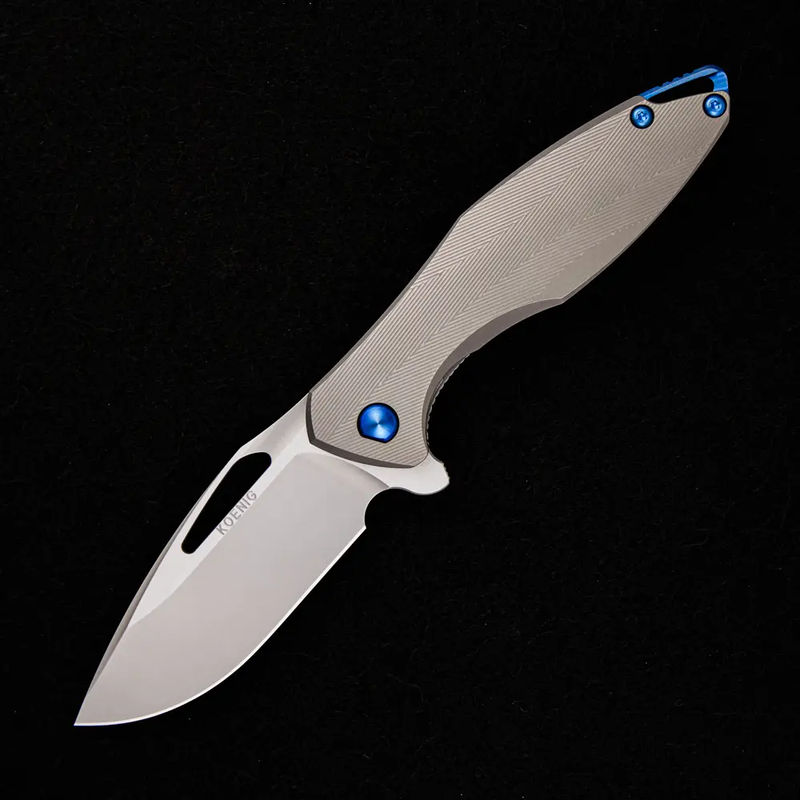 ARIUS – PATTERNED TITANIUM HANDLE – BLUE HARDWARE – BURNISHED W/ POLISHED FLATS 20CV BLADE