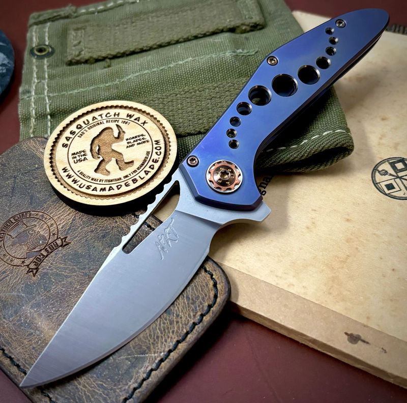 NK&T Custom Hydra Framelock with 5/32 Magnacut Blade, Blue Ti Huricane Speedhole Handles, Bronze Ti Hardware and Copper Pivot Collar