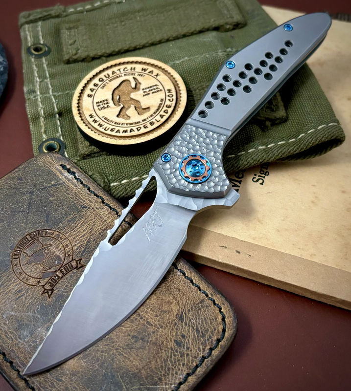 NK&T Custom Hydra Framelock with 5/32 Magnacut Blade, Ti Speedhole Bolstered Handles, Blue Ti Hardware and Copper Pivot Collar
