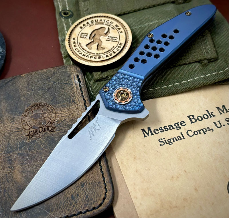 NK&T Custom Hydra Framelock with 5/32 Magnacut Blade, Blue Ti Speedhole Bolstered Handles, Bronze Ti Hardware and Copper Pivot Collar