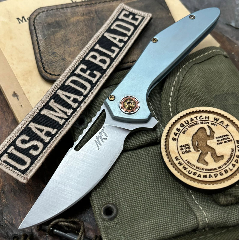 NK&T Custom Hydra Framelock with 5/32 Magnacut Blade, Silver Blue Ti Frame Handles, Bronze Ti Hardware and Copper Pivot Collar